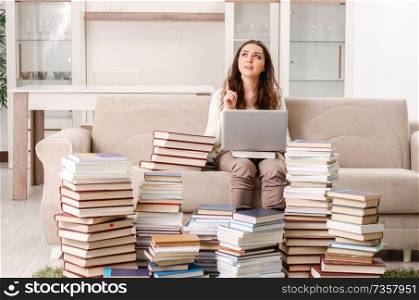 Young female student preparing for exams at home 