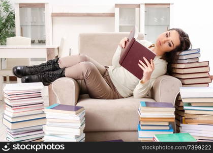 Young female student preparing for exams at home 