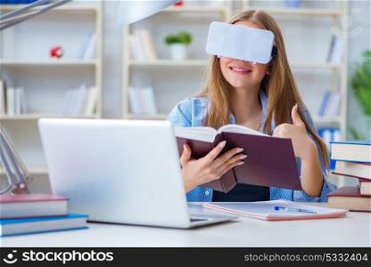 Young female student preparing for exams with VR glasses