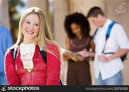 Young female student smiling at camera