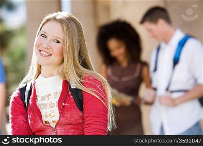 Young female student smiling at camera