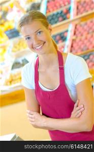 Young female supermarket worker