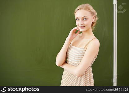 Young female teacher working with children at school