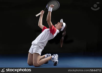 Young female tennis player celebrating victory at court