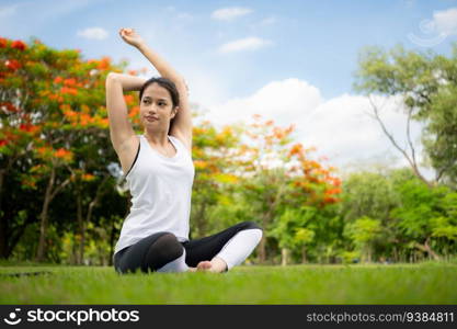 Young female with outdoor activities in the city park, Yoga is her chosen activity.