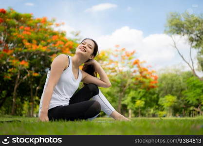 Young female with outdoor activities in the city park, Yoga is her chosen activity.