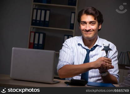 Young financial manager working late at night in office 