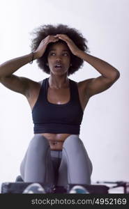 young fit african american woman doing sit ups in fitness studio at the gym.Abdominal exercises Sit up