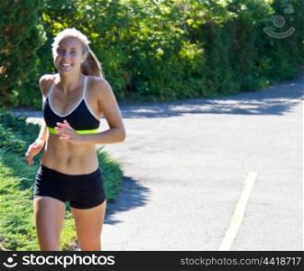Young fit woman running for fitness
