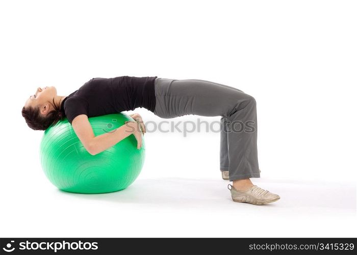 Young fit woman with gym ball doing pilates exercise, isolated on white background.