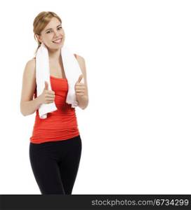 young fitness woman showing thumbs up. young beautiful fitness woman showing thumbs up on white background