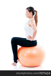 Young Fitness Woman Sitting On Balance Ball