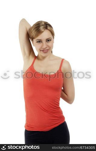 young fitness woman stretching. young fitness woman stretching her arms on white background