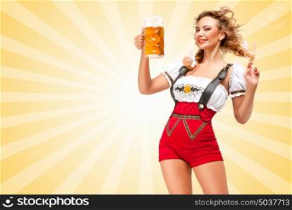 Young flirting sexy woman wearing red jumper shorts with suspenders in a form of a traditional dirndl, holding a beer mug on colorful abstract cartoon style background.
