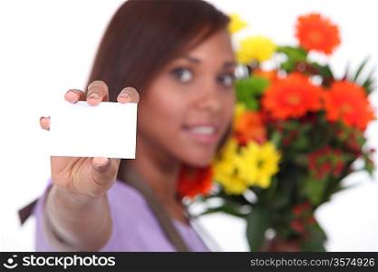 young florist showing business card