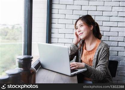Young Freelancer Woman Working on Computer Laptop in Cozy House, Female in Thoughtful Posture Looking Outside Window, Lifestyle of New Generation People, Dreaming for Success