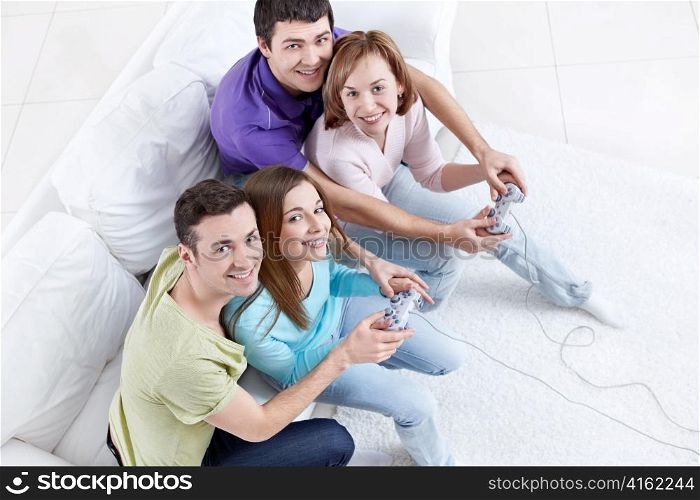 Young friends playing video games