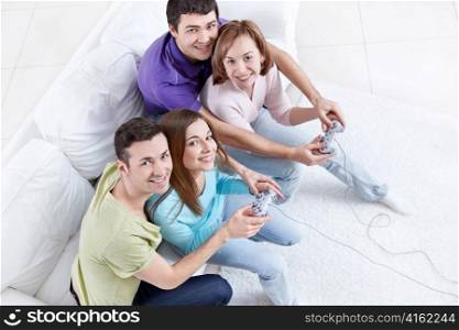 Young friends playing video games