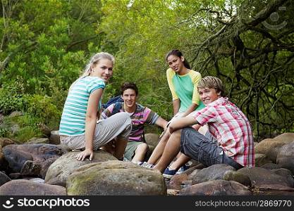 Young Friends Sitting on Rocks