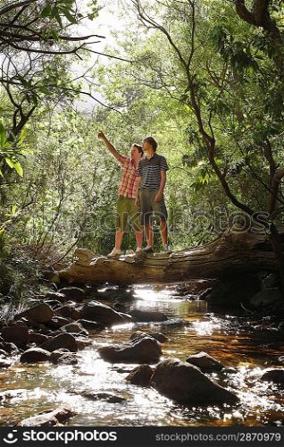 Young Friends Standing on Log