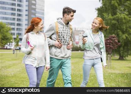Young friends walking at college campus
