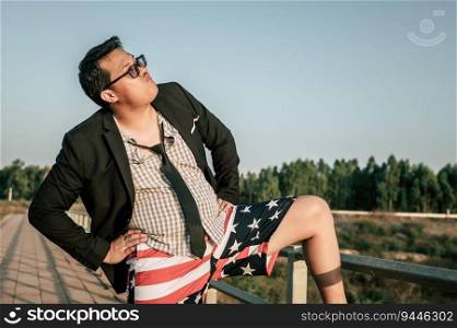 Young funny Asian Businessman wearing shirt and tie with shorts and eyeglasses in crazy and funny manner posture, copy space