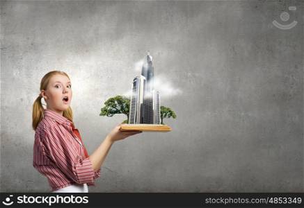 Young funny girl with opened book in hands. Girl excited with book