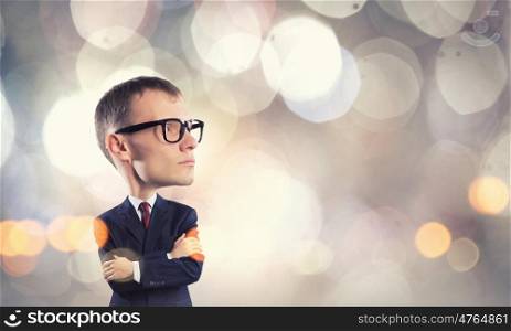 Young funny man in glasses with big head. He has great mind