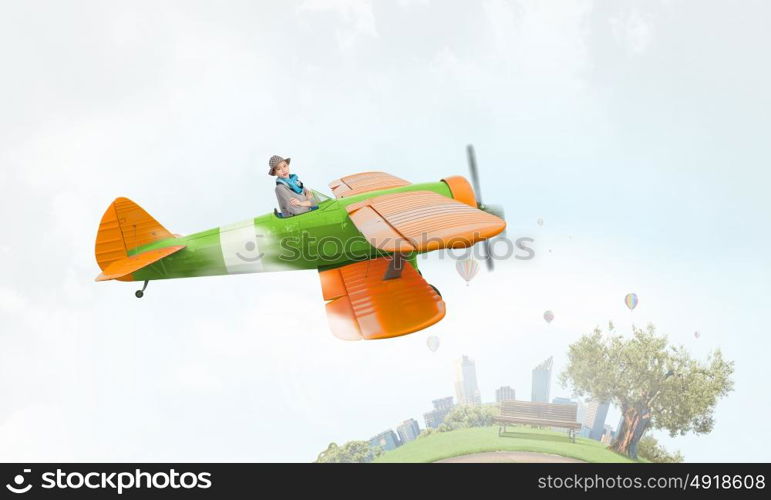 Young funny woman flying in air in retro airplane. Girl flying old plane