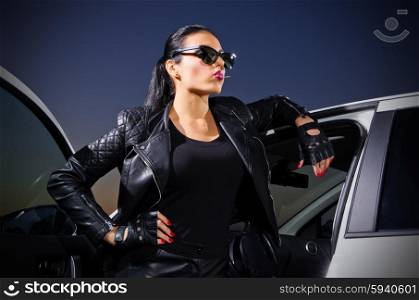 Young gangster woman with the car