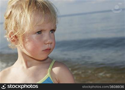 Young girl (3-4) at ocean