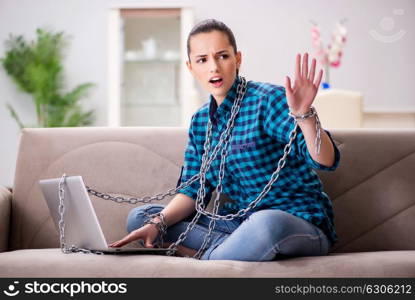 Young girl addicted to laptop computer and internet