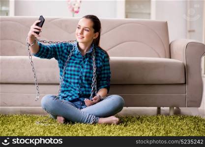 Young girl addicted to mobile phone