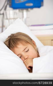 Young girl asleep in Accident and Emergency bed