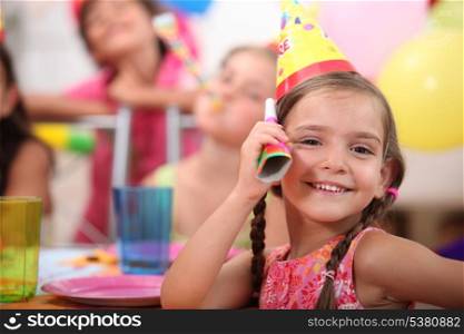 Young girl at a child&rsquo;s birthday party
