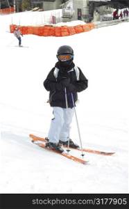 Young girl at downhill skiing resort