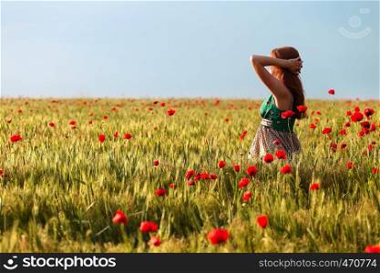 young girl at the poppies field
