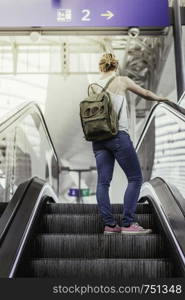 Young girl at the train station, travelling