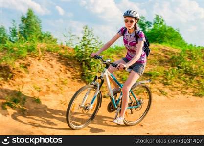 young girl athlete on a bike in the motion