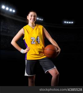 Young girl basketball player at sports hall