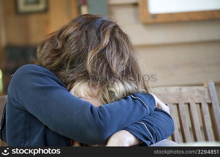 Young girl being hugged by her mother