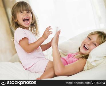 Young Girl Being Woken Up By Her Little Sister
