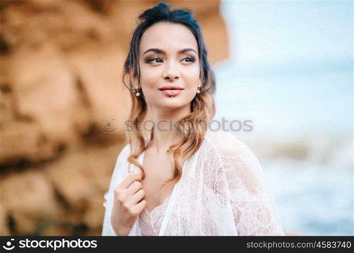 young girl bride in her underwear on the shore of the sea dreams of the future