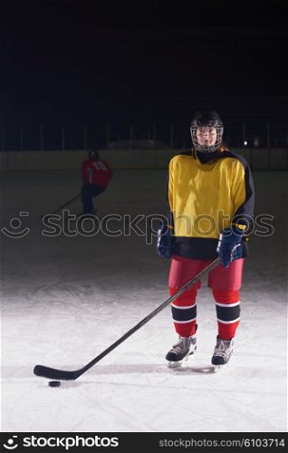 young girl children ice hockey player portrait on training in black background