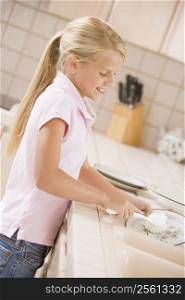 Young Girl Cleaning Dishes,