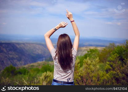 Young girl dancing in the wild