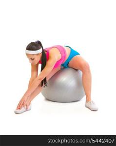 Young girl doing stretching exercises on fitness ball isolated on white&#xA;