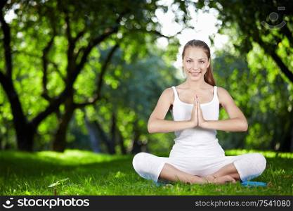Young girl doing yoga outdoors