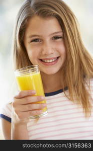 Young Girl Drinking Orange Juice