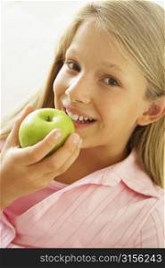 Young Girl Eating An Apple